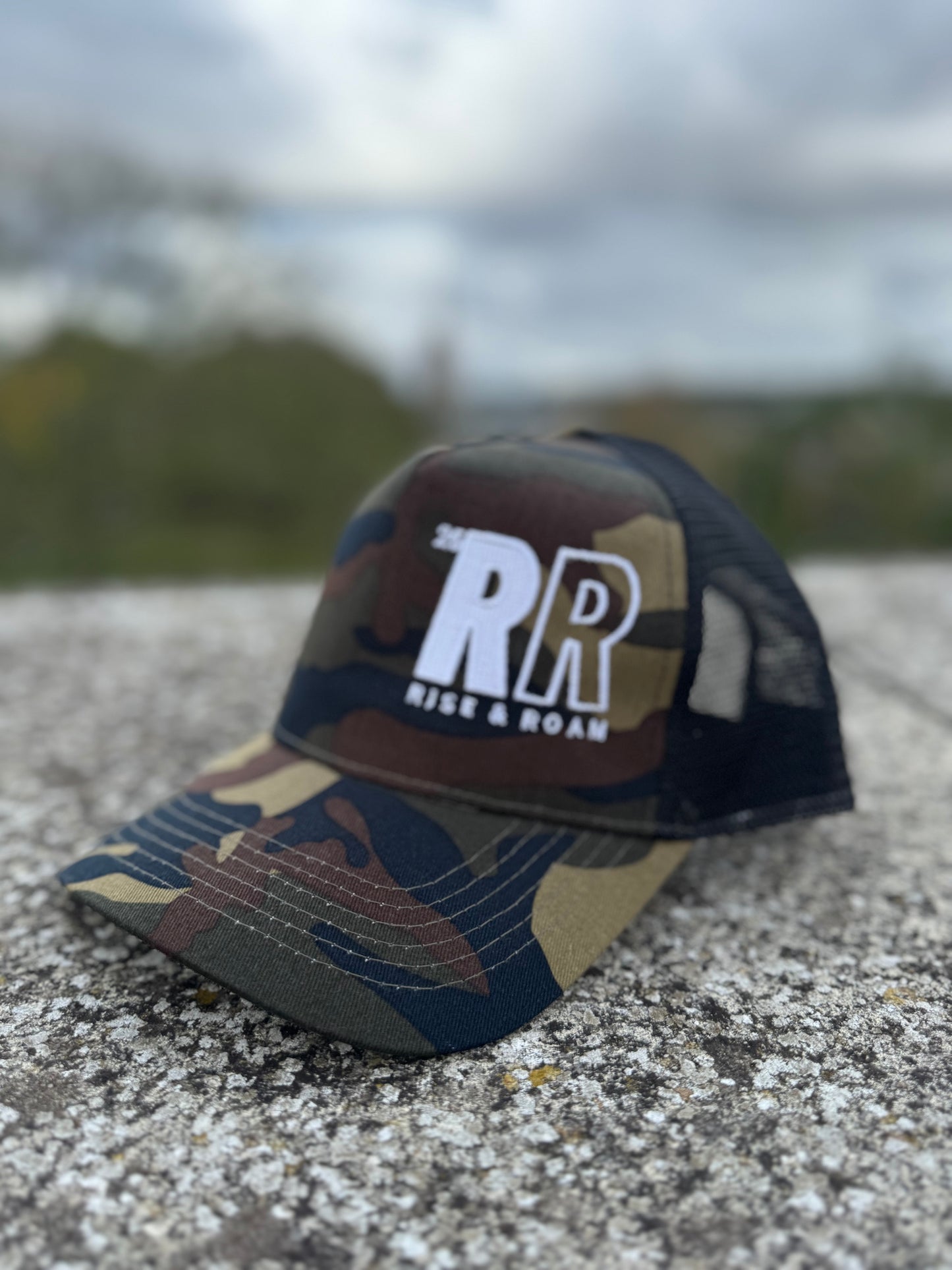 Rise & Roam Brand - Bold RR Logo Camo Trucker Cap.